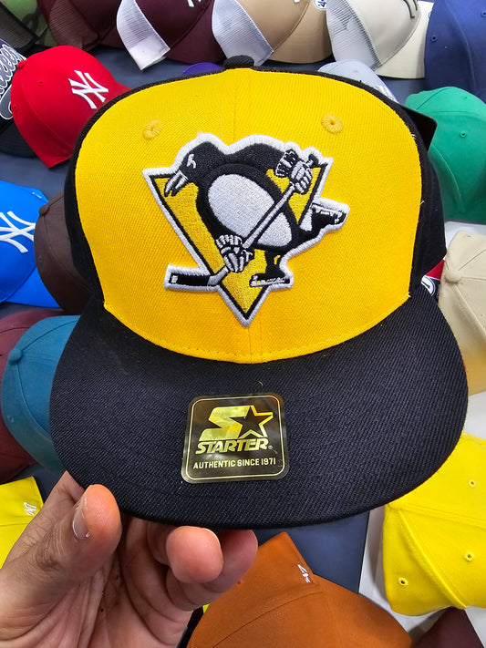 Starter gorra Pittsburg Penguins negra y amarilla visera plana NHL